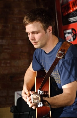 Tom Playing Guitar